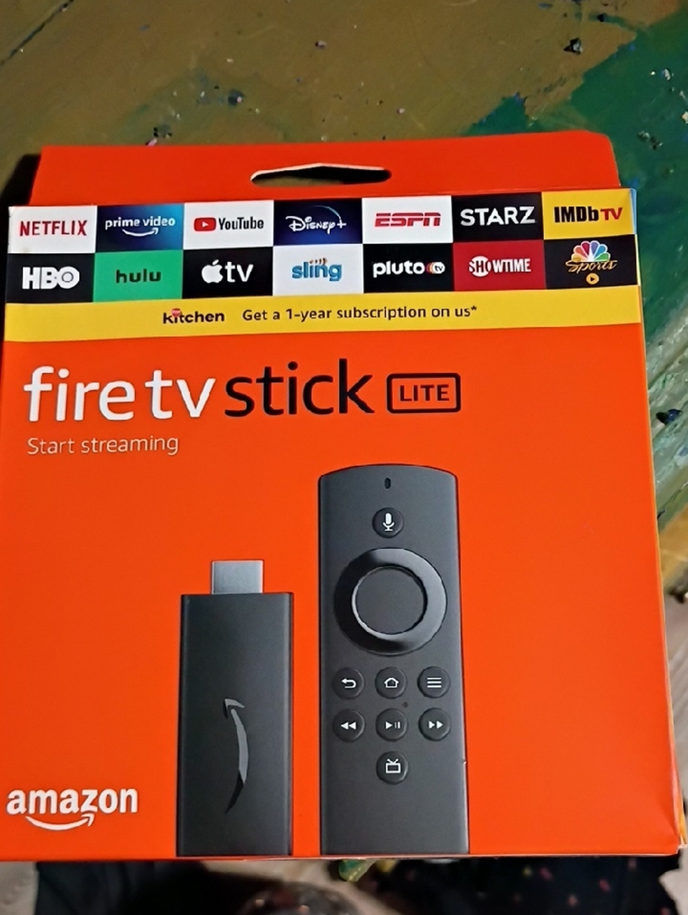 Amazon Fire TV Stick Lite — Orange Packaging with Black Device